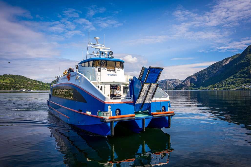 Blue and white passenger boat on the fjord.
