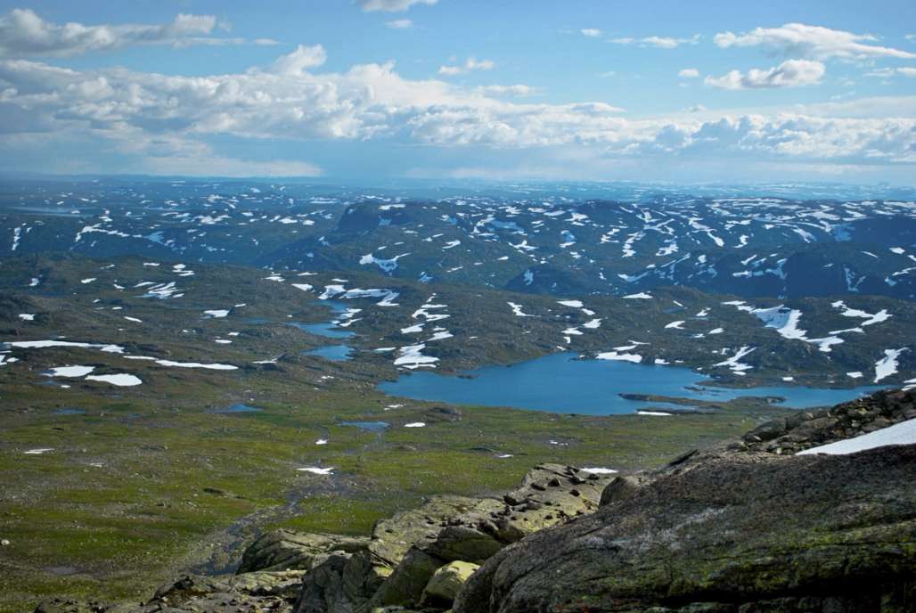 a view of a lake from the top of a mountain .