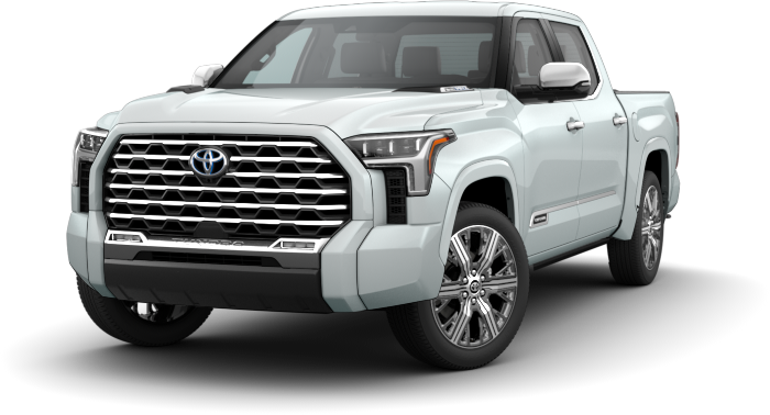 Exterior front side view of a white Toyota truck