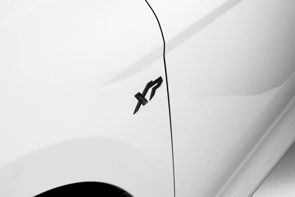 Exterior view of a Toyota Camry XP shadow Hybrid HEV. Showing off its sleek headlights and modern design.