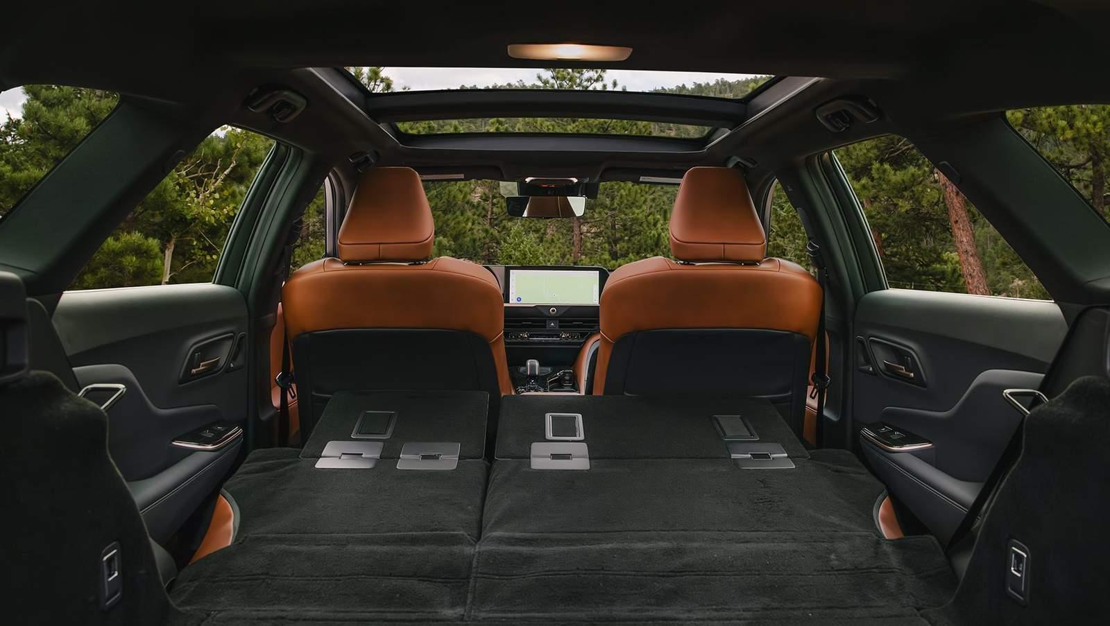 inside a Toyota Crown Signia with fold flat 2nd row seats and panoramic sunroof