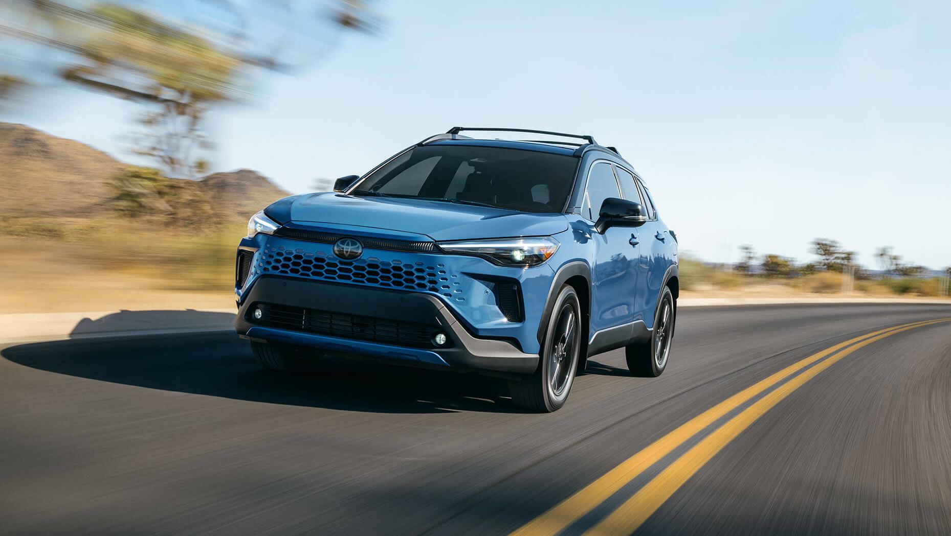 Exterior view of a toyota Corolla Cross suv driving on the road