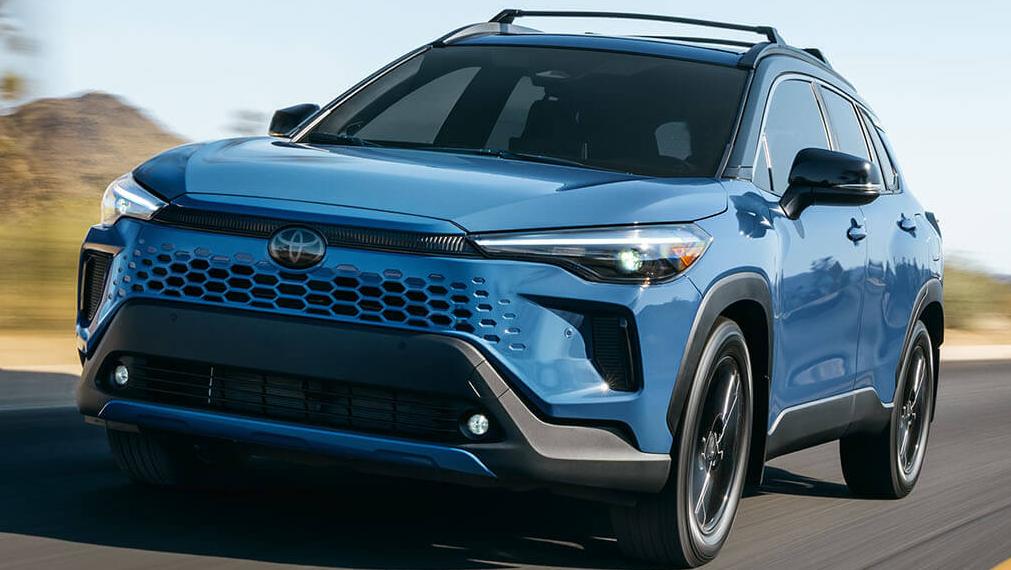 Exterior view of a toyota Corolla Cross suv driving on the road