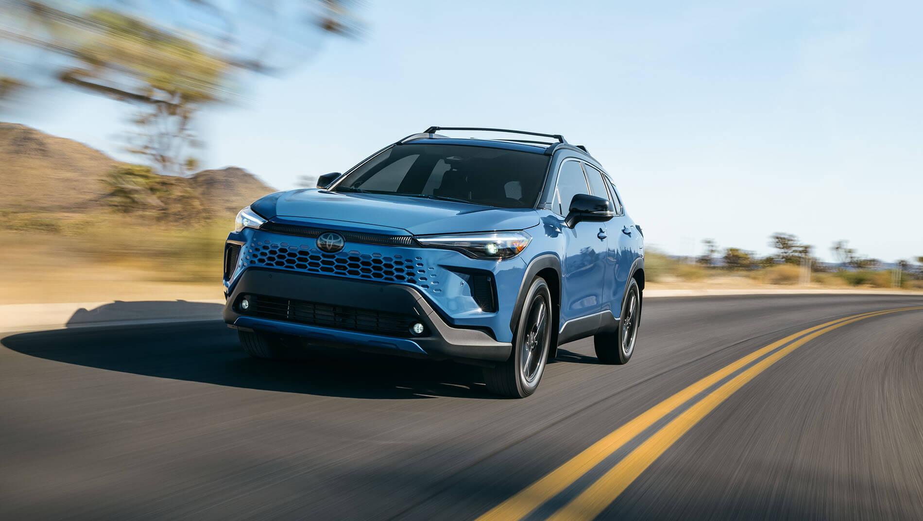 Exterior view of a toyota Corolla Cross suv driving on the road