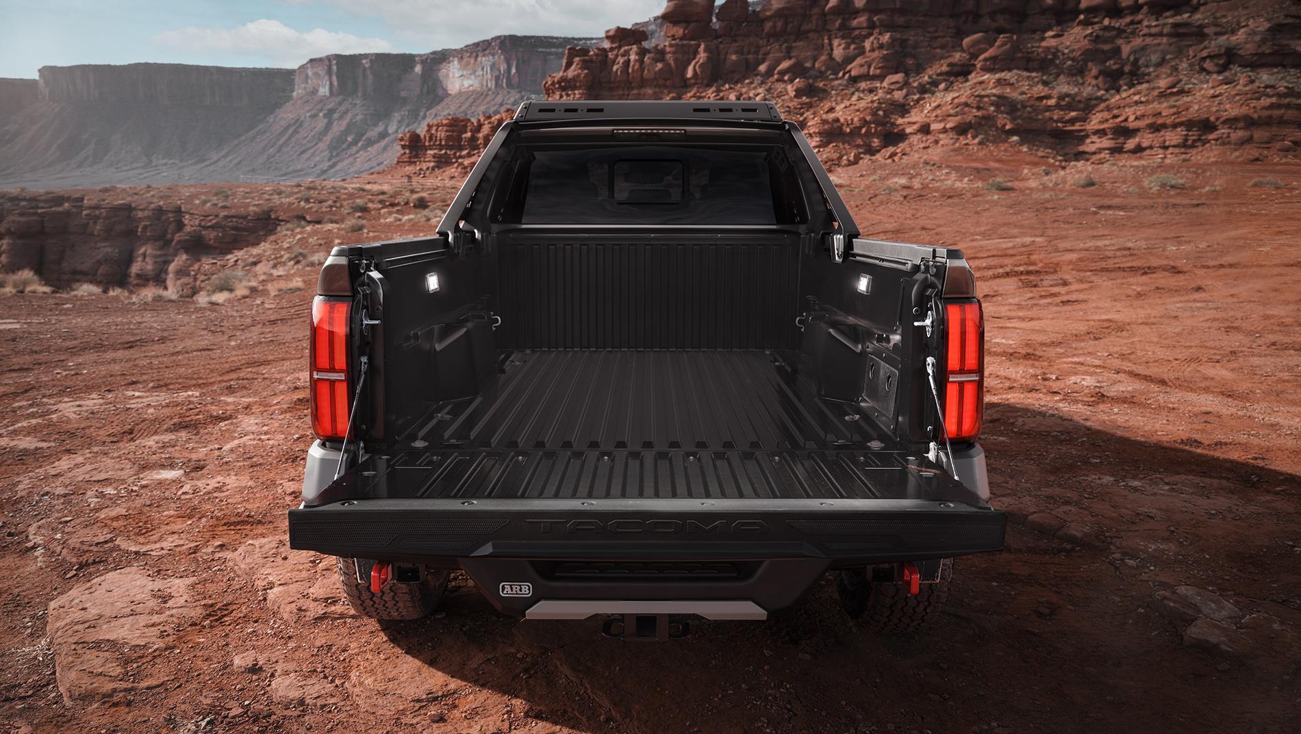 2024 Toyota Tacoma with bedliner parked on Rocky Mountains