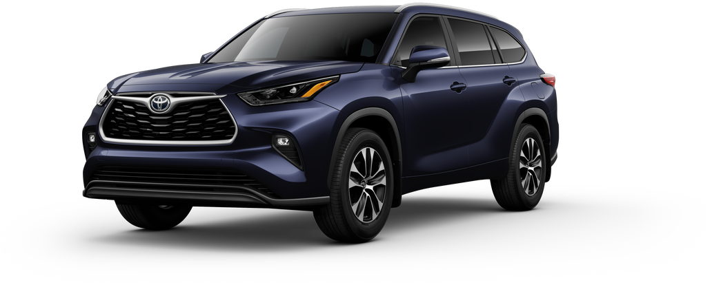 Exterior view of a Toyota Highlander SUV. Highlighting its silver alloy wheels and modern design.