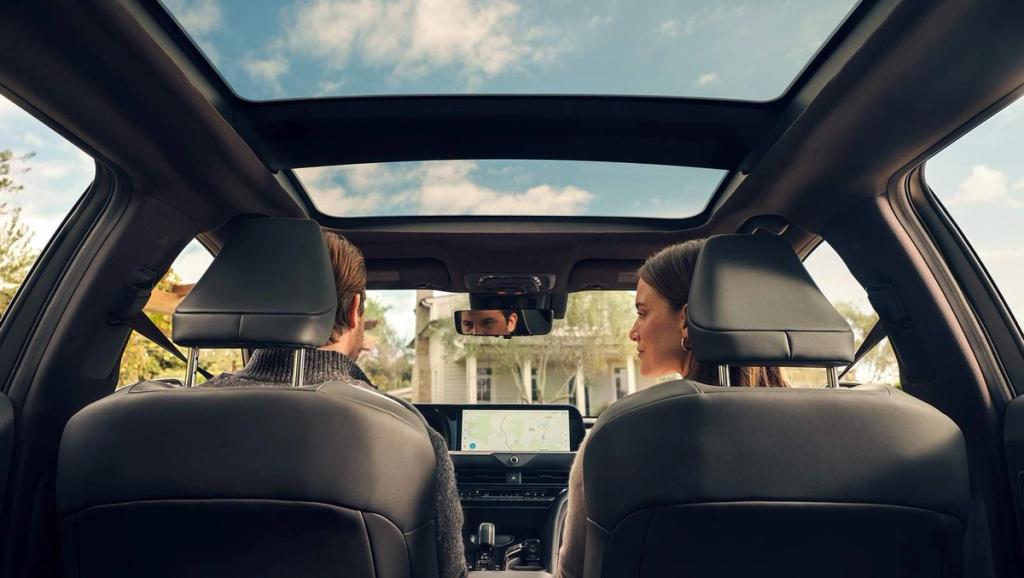 man and woman riding inside a Toyota Crown Signia