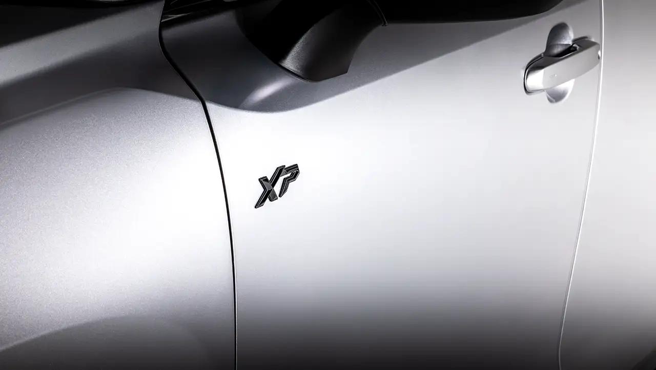 Closeup of signature black XSeries badging on a white Toyota Grand Highlander XP, Grand Highlander XSeries model