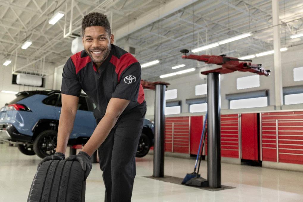 Replacing a Tire, Tech replacing a tire