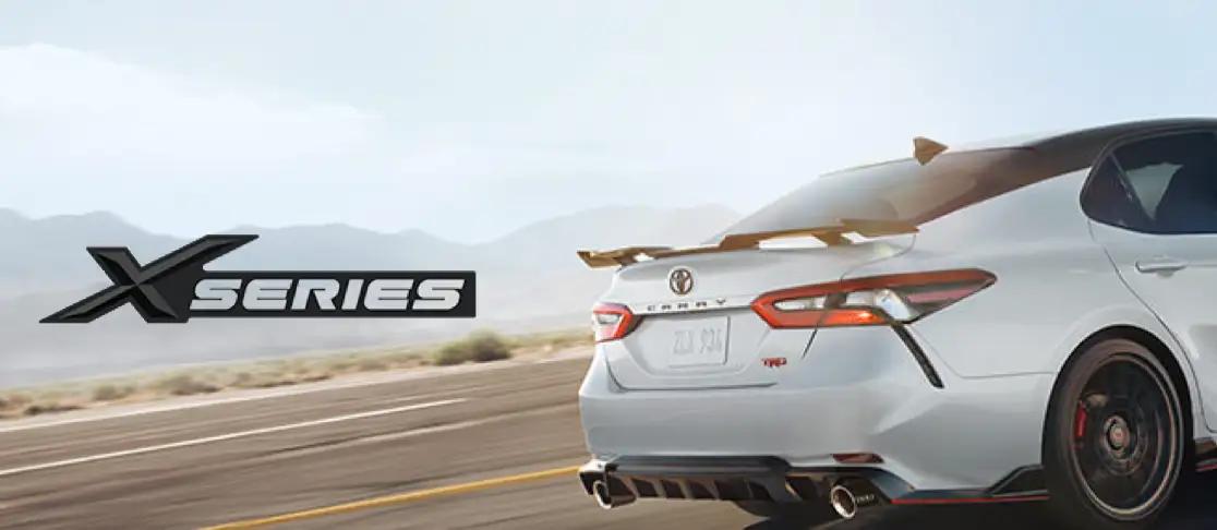 Toyota Xseries custom Camry driving past mountains