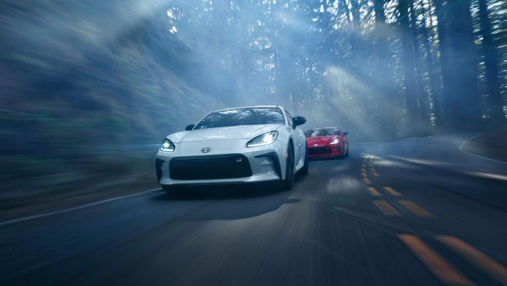 2024 Toyota GR86 driving down a forrest road