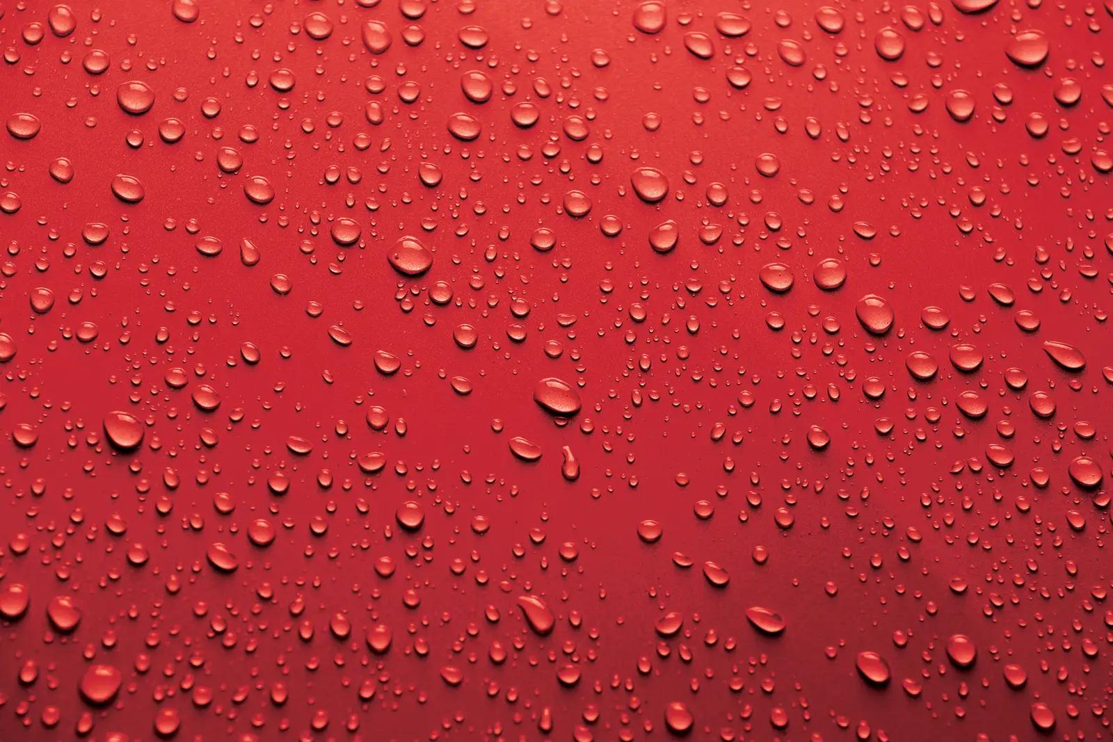 water beading on red paint