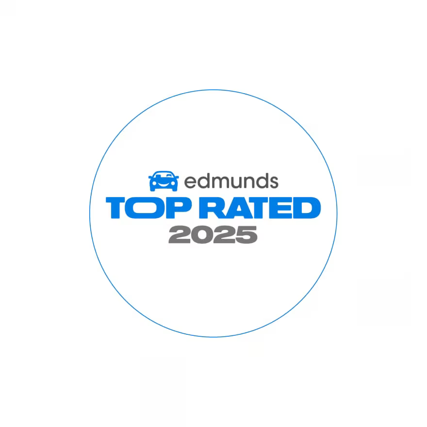 Logo with blue text "edmunds TOP RATED 2025" inside a thin blue circle, featuring a small car icon above the word "edmunds,"