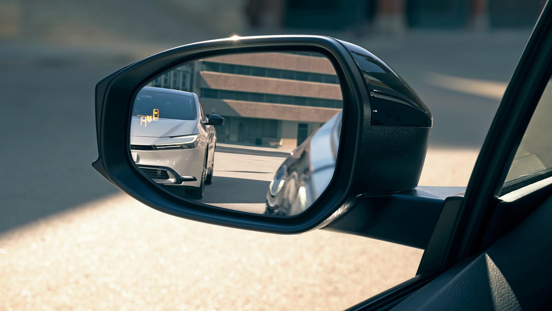side mirror of a 2023 Toyota Prius showing blind spot detection