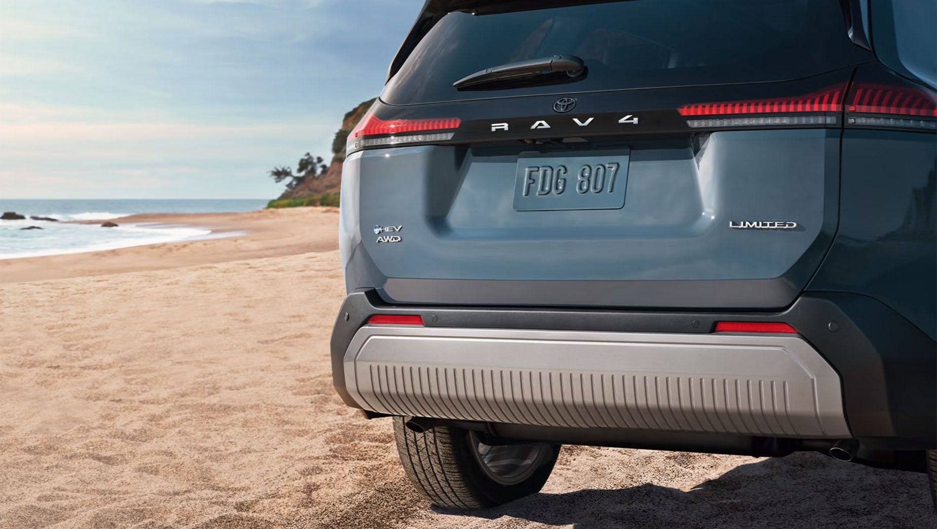 Toyota I-FORCE MAX Hybrid HEV Tundra or Tacoma demonstrating towing and hauling capability with a large load in the bed