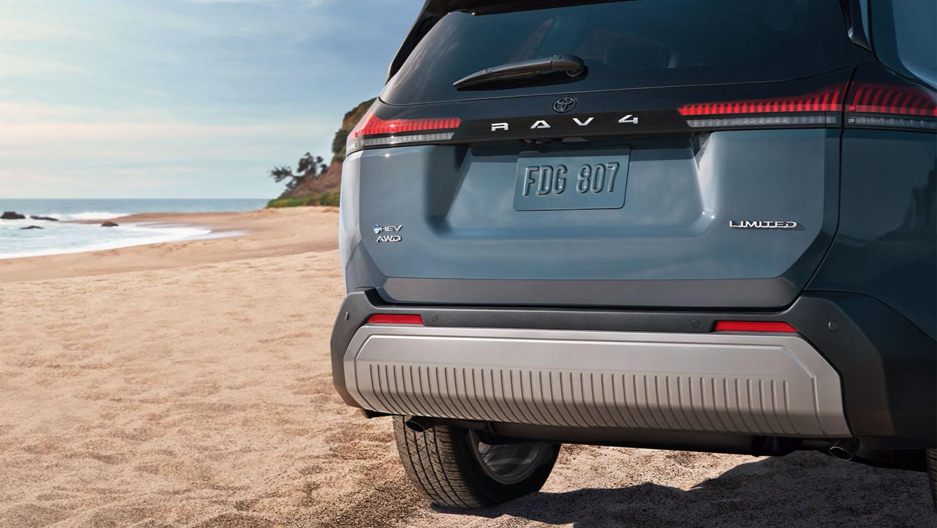 Toyota I-FORCE MAX Hybrid HEV Tundra or Tacoma demonstrating towing and hauling capability with a large load in the bed