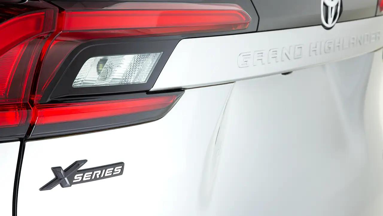 Closeup of signature black XSeries badging on a white Toyota Grand Highlander XP, Grand Highlander XSeries model
