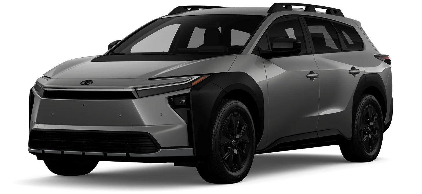 A silver Toyota SUV with black trim, black wheels, and roof rails is parked on a white background, viewed from the front-side angle.
