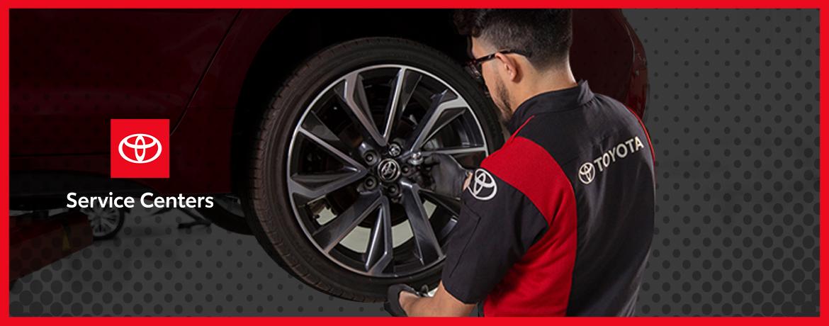 Toyota Service Centers technician working on a tire
