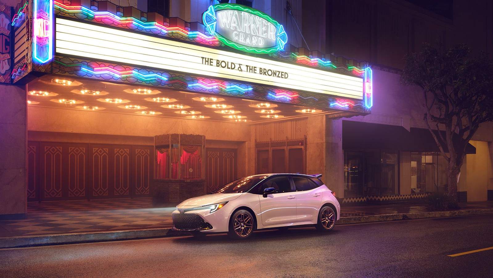 2024 Toyota parked in front of a movie theater at night