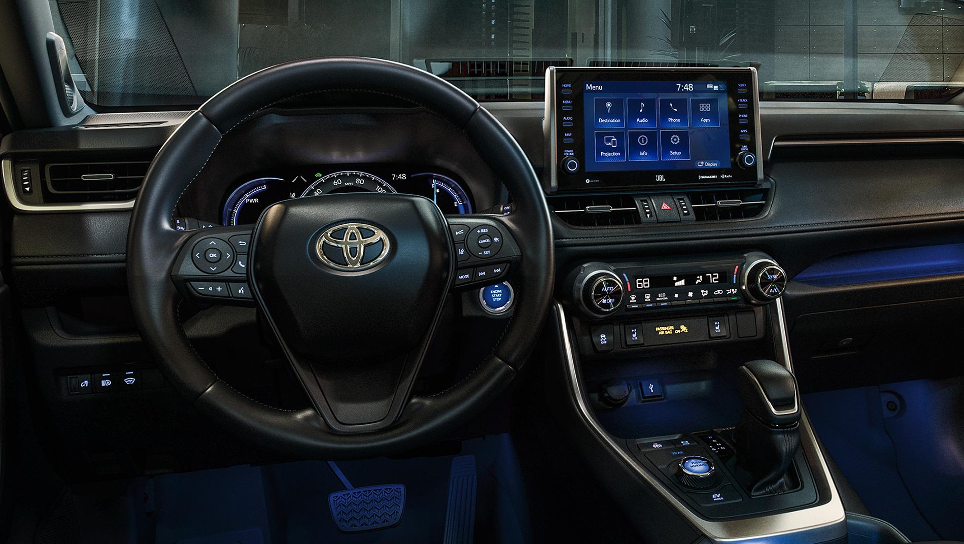 inside a Toyota RAV4 Prime with blue ambient lighting and touchscreen