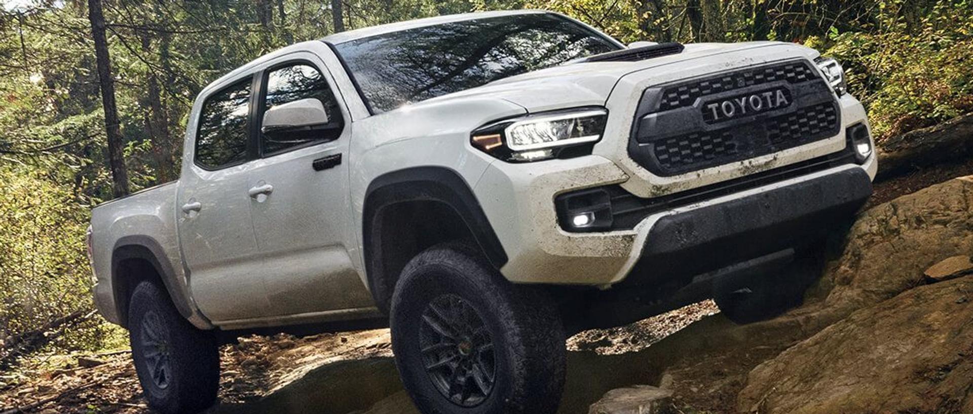 Toyota Truck touch - white Toyota Tundra driving up a mountain