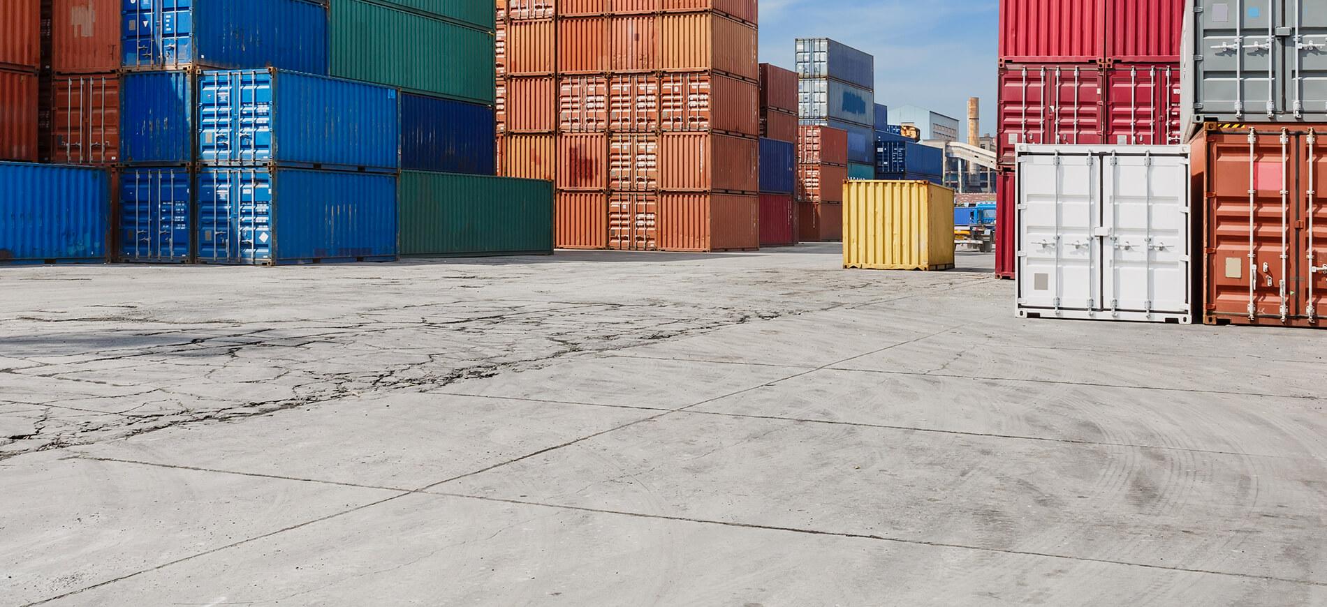 colorful shipping containers in an empty shipping yard