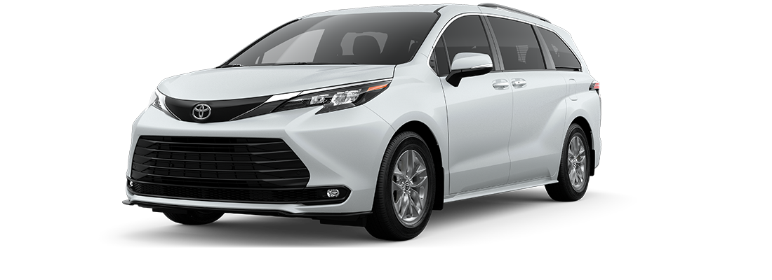 A white Toyota Sienna minivan viewed from the front left angle, featuring sleek headlights, a large black grille, and silver alloy wheels, set against a plain white background.