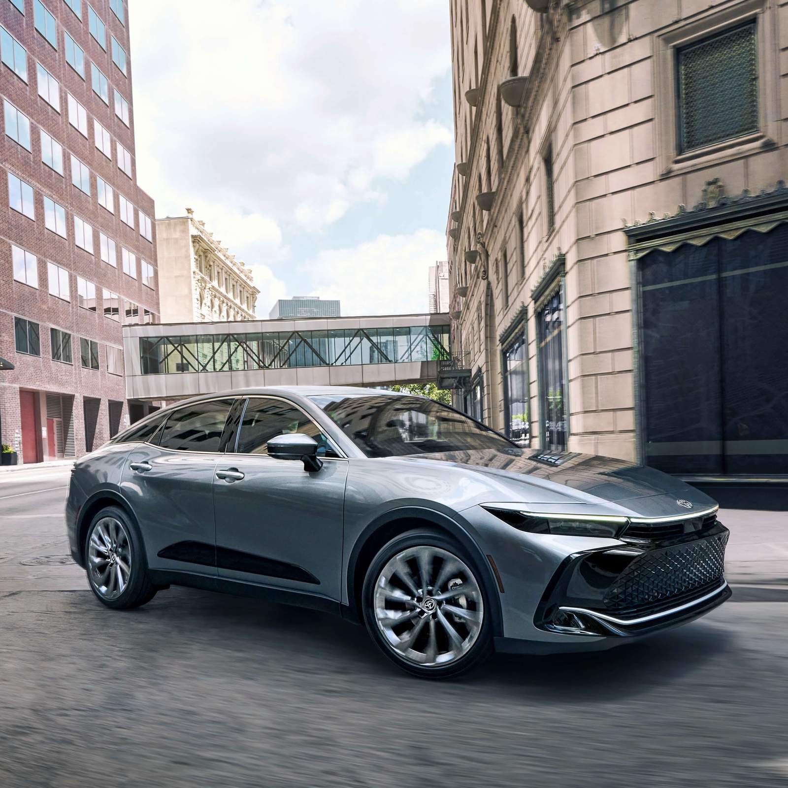 Silver Toyota 20223 Crown driving on city street