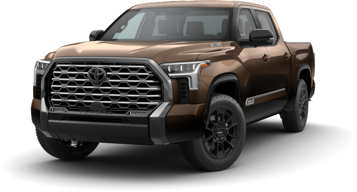 An exterior view of a brown 2024 Toyota Tundra pickup truck with a large chrome grille and black wheels.