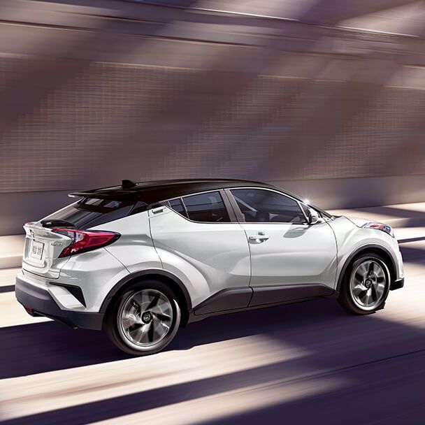 2022 Toyota C-HR driving down the road.