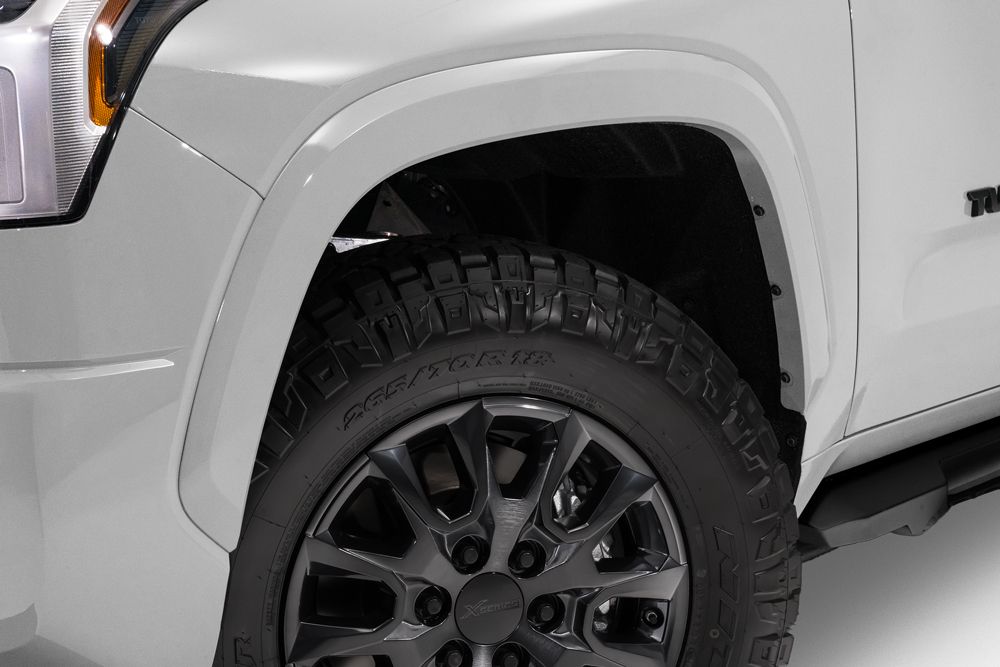 Exterior view of a Toyota Tundra XSP Shadow I-FORCE MAX Hybrid HEV. Showing off its prominent front grille and four doors.