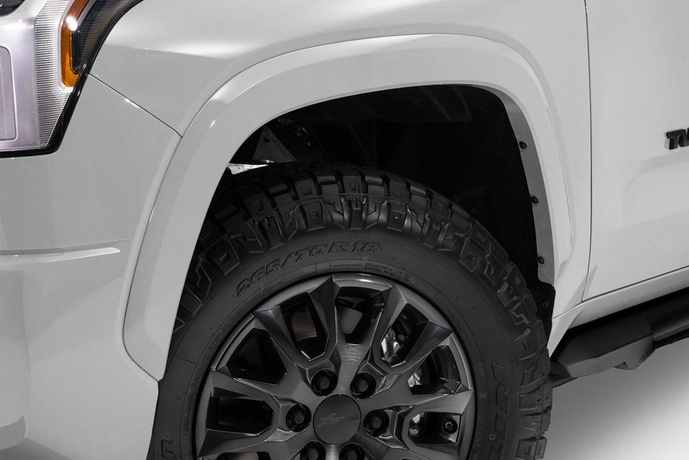 Exterior view of a Toyota Tundra XSP Shadow I-FORCE MAX Hybrid HEV. Showing off its prominent front grille and four doors.