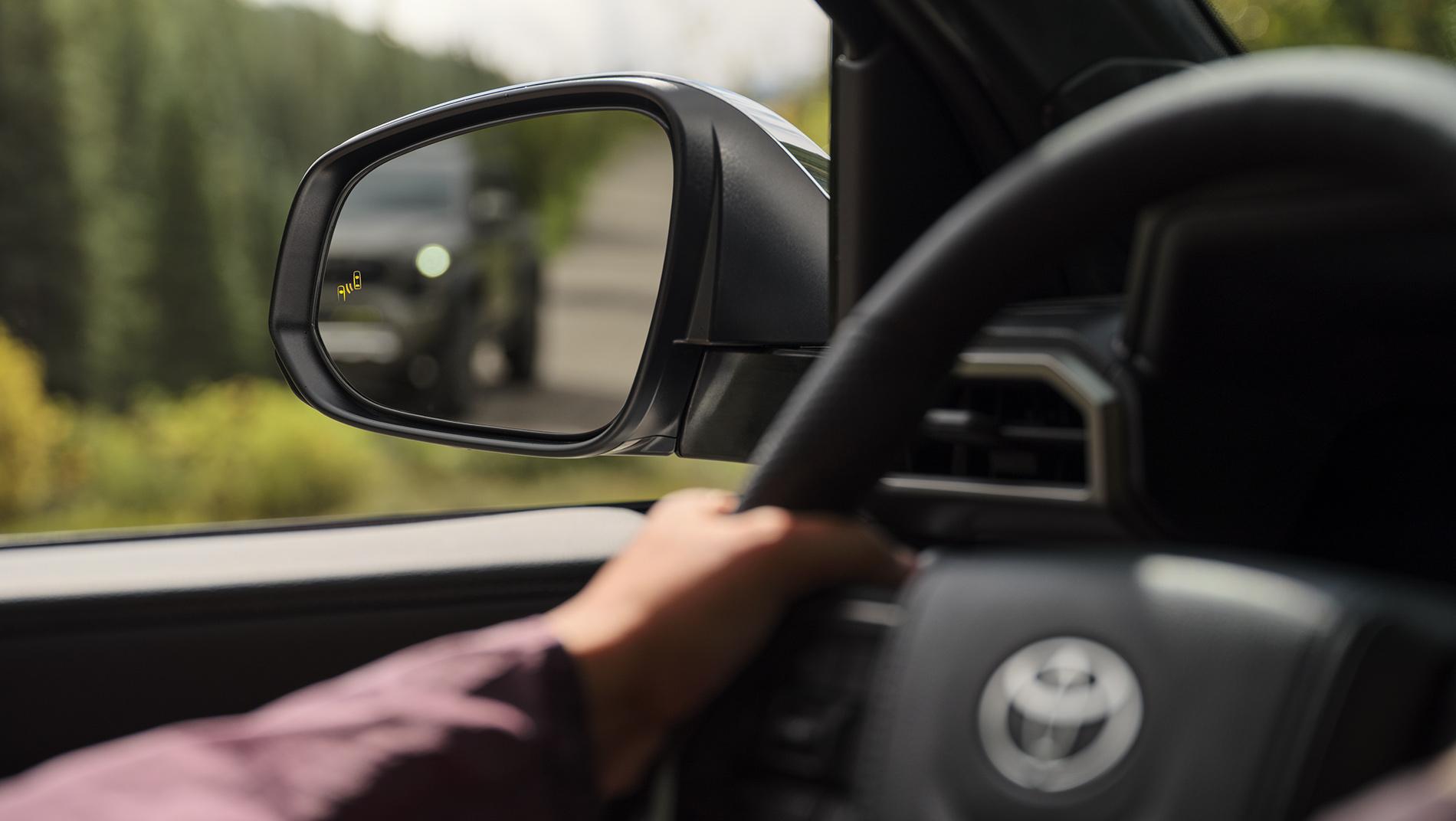 2024 Toyota Tacoma showing side mirror with blind spot monitoring