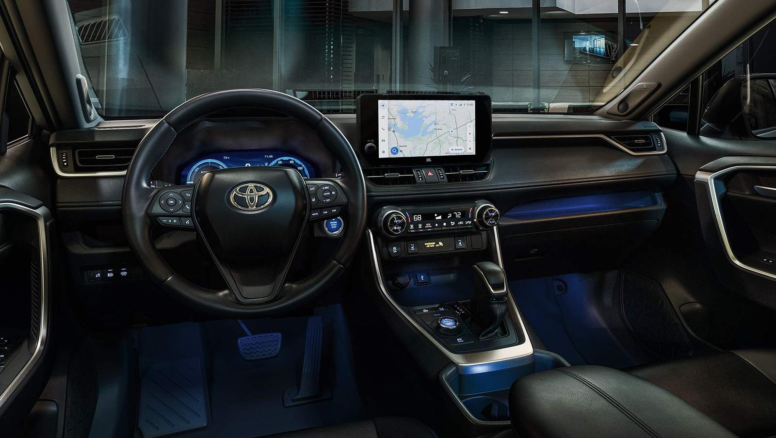 inside a 2024 Toyota RAV4 at night showing navigation on the multimedia touchscreen