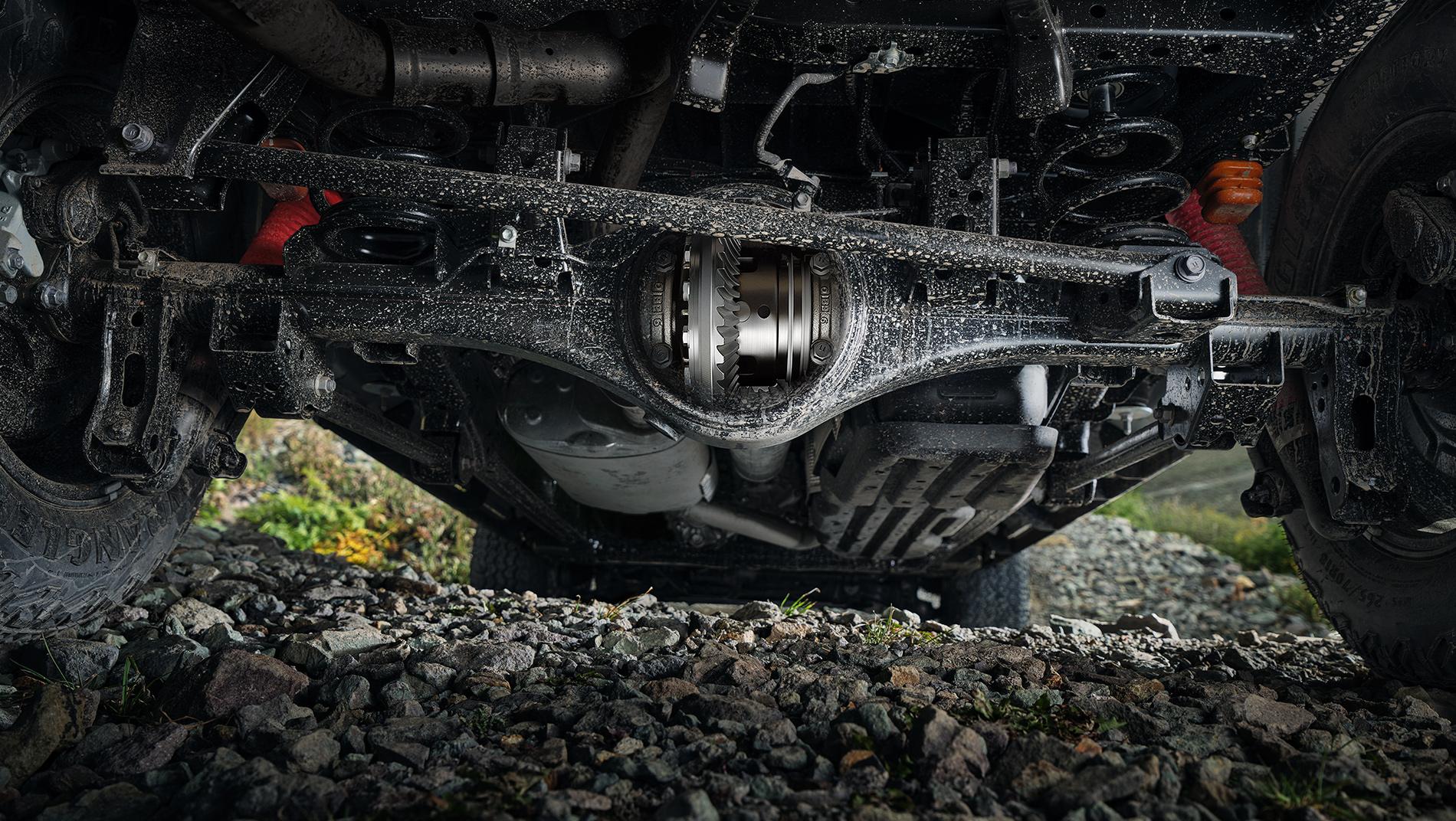 shot of the undercarriage of the 2024 Toyota Tacoma as it drives over a rocky road