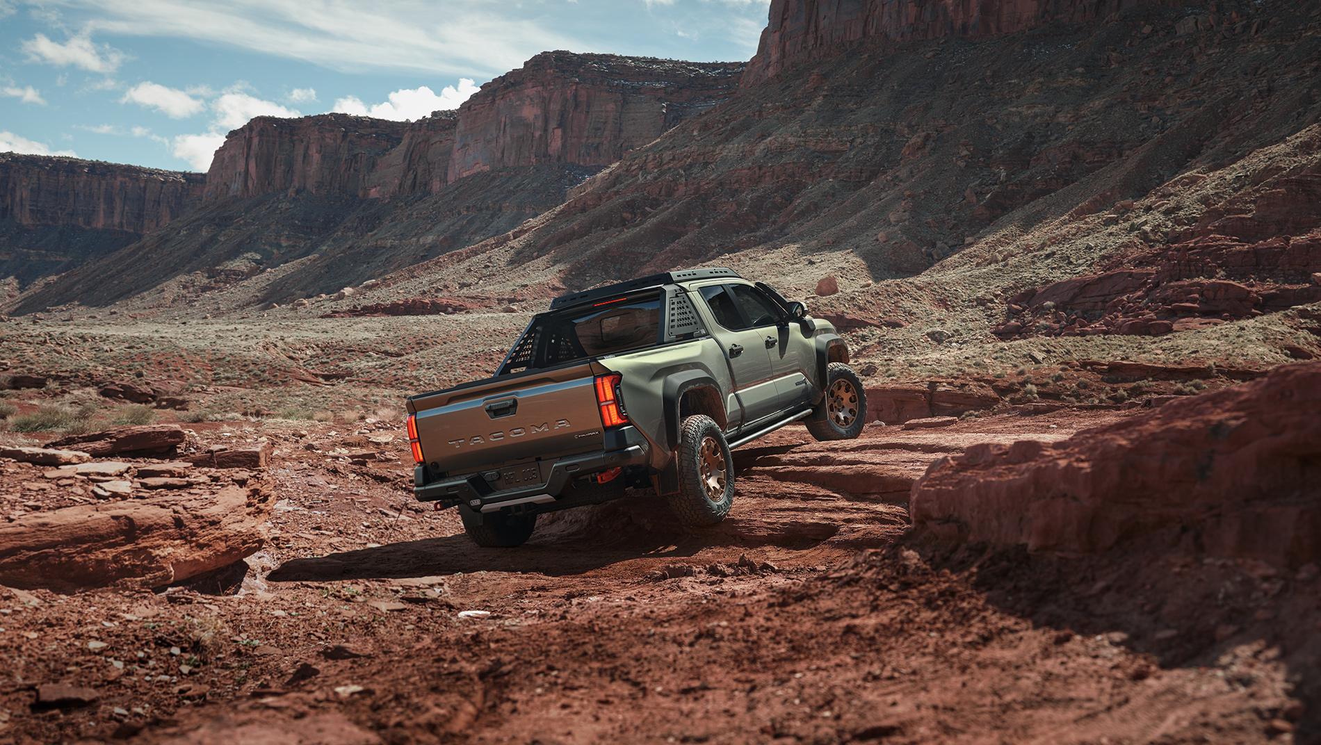 2024 Toyota Tacoma in CRAWL mode driving up a rocky mountain without a road