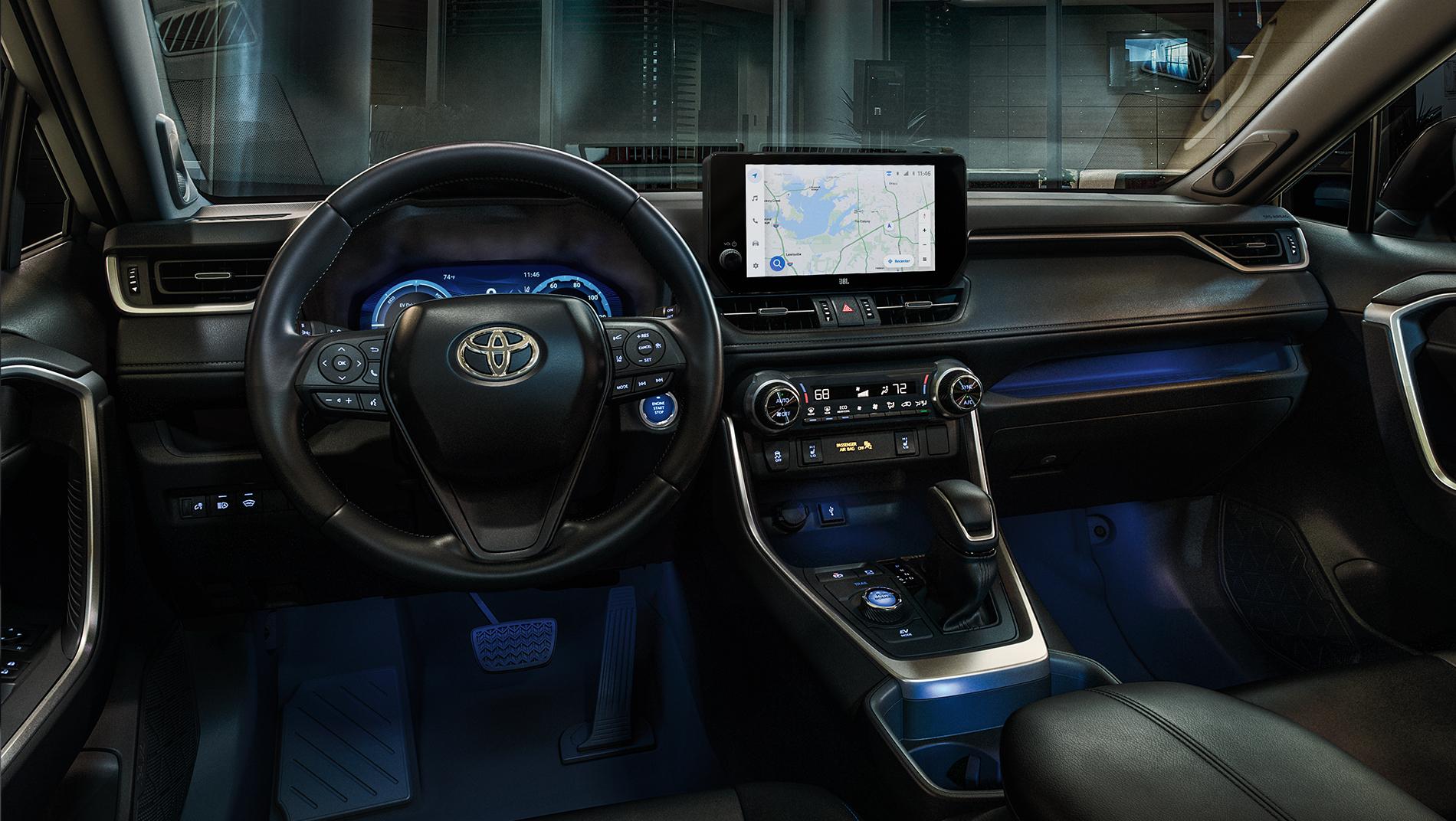 Inside a Toyota Hybrid with ambient lighting and large touchscreen controls