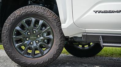 Zoomed in picture of the tires on the 2024 Toyota Tacoma XP Predator.