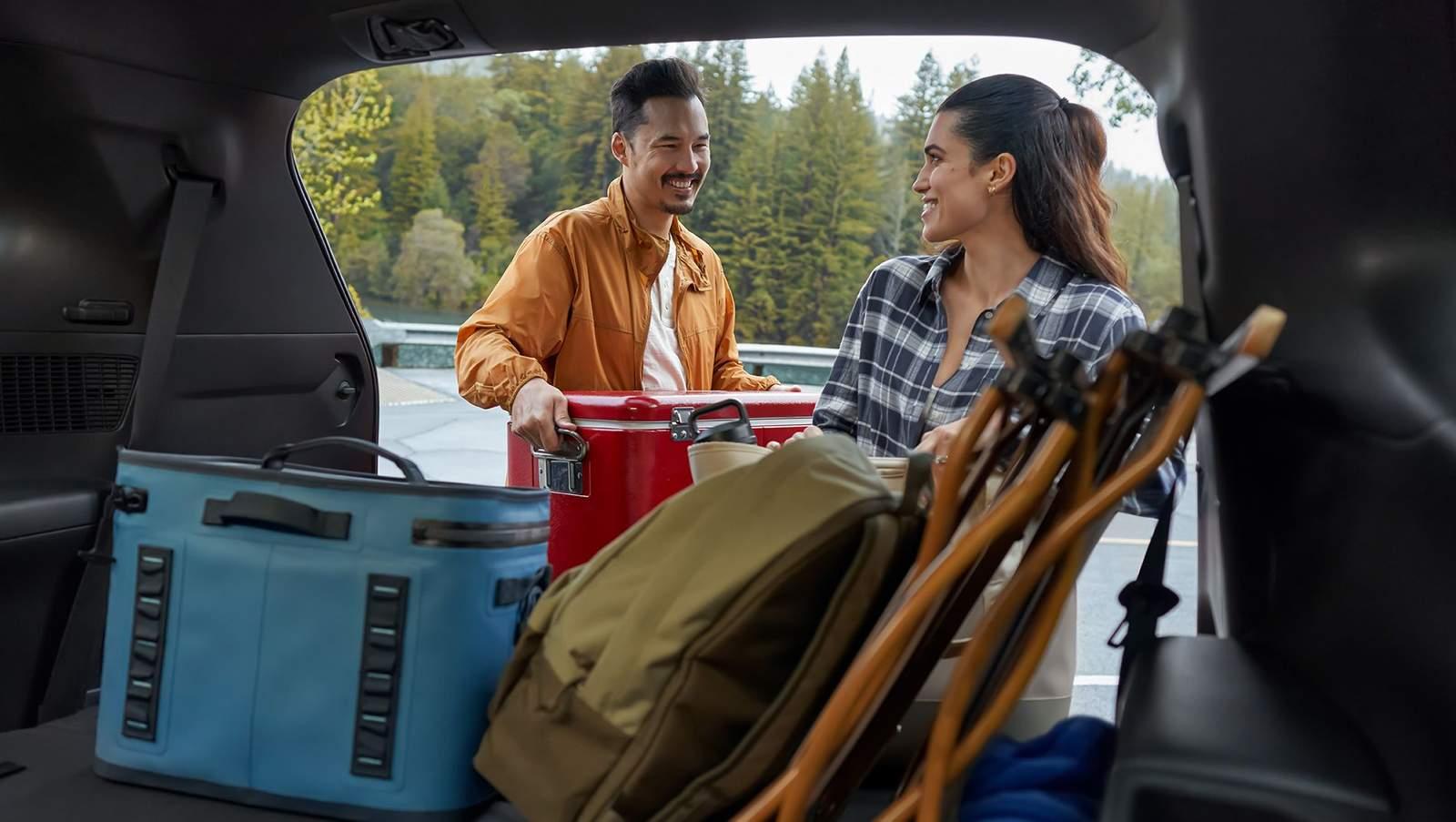 Promotional image from Toyota showing a vehicle, accessories, or people using the vehicle in everyday or outdoor environments.