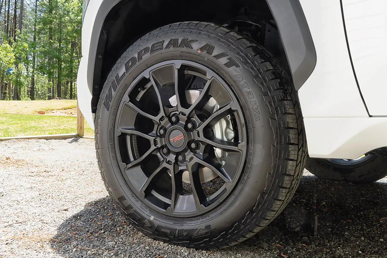 close up of a white Toyota Tundra XP XSeries upgraded accessory package showing the upgraded TRD Wheels