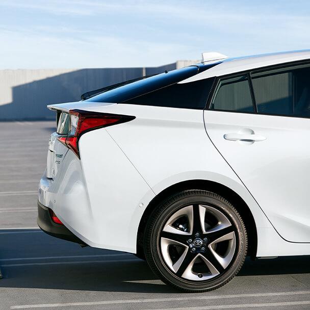 exterior shot of the back half of a white Toyota Prius