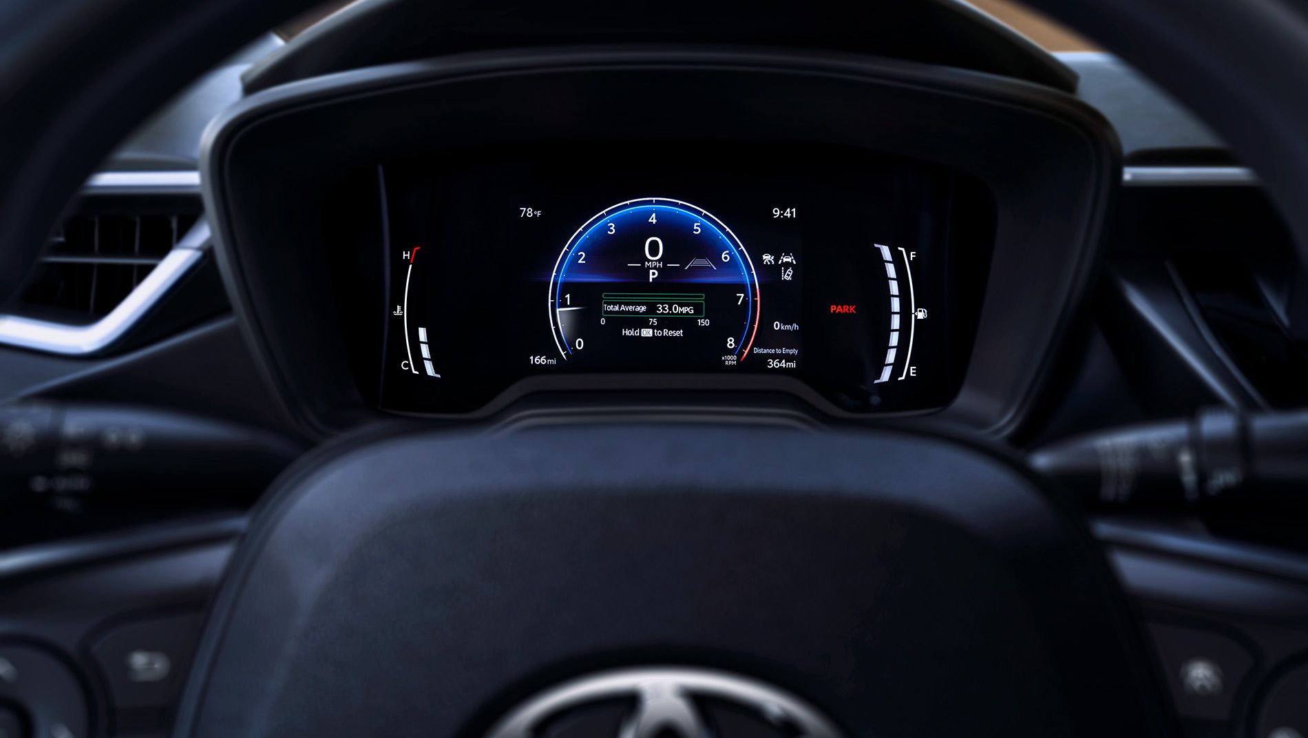 Close-up view of a 2026 toyota corolla hatchback digital dashboard display showing speedometer, fuel gauge, temperature, mileage, and other vehicle information