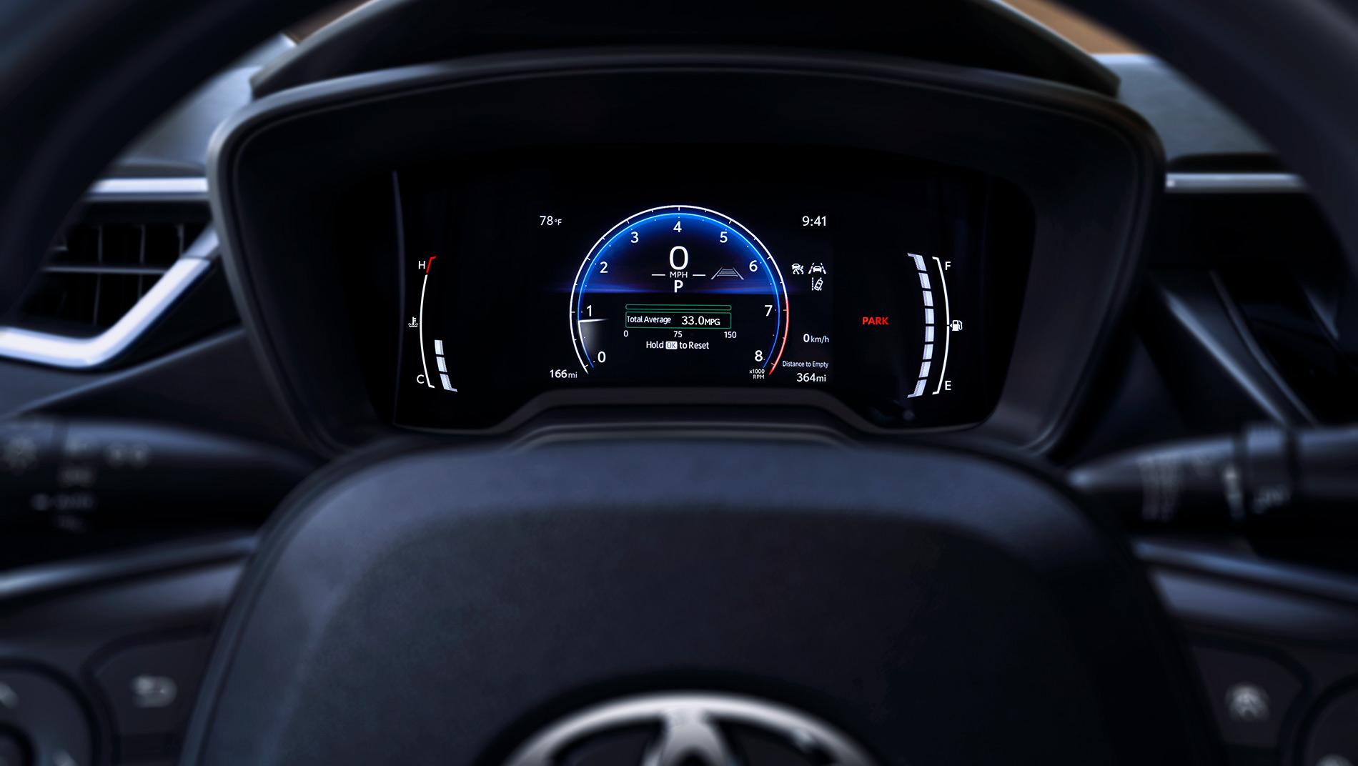 Close-up view of a 2026 toyota corolla hatchback digital dashboard display showing speedometer, fuel gauge, temperature, mileage, and other vehicle information
