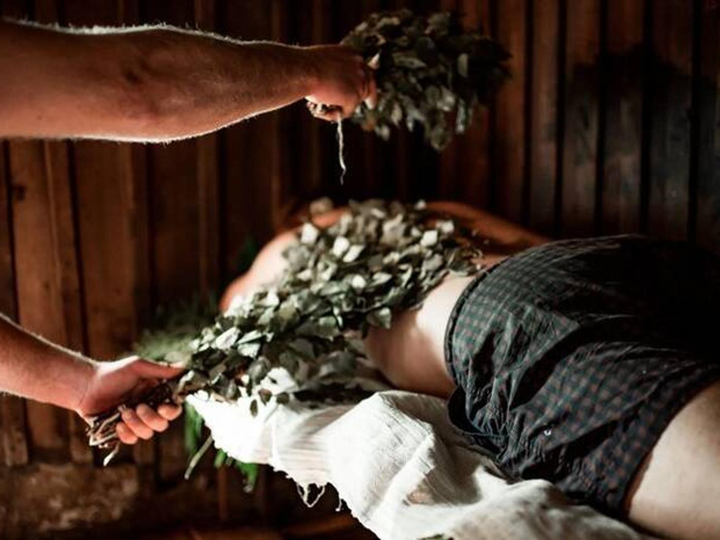 A sauna ritual with birch whisks