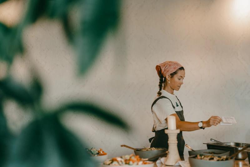 A chef setting out bowls on the buffet