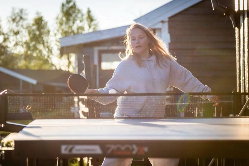 Playing table tennis outside the cabins