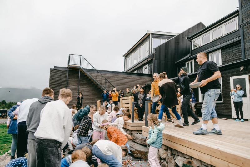 Children and adults gathered on the steps at the family festival