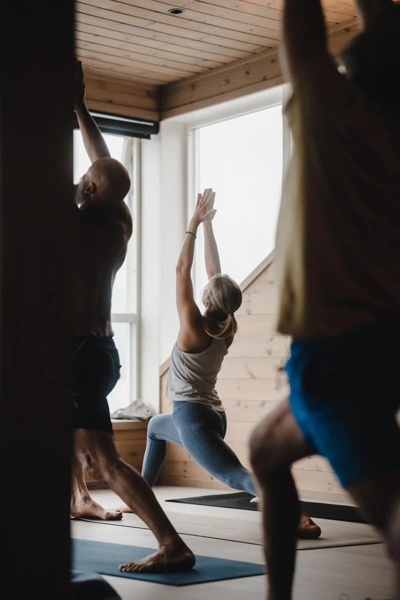 Students in a standing pose in the shala