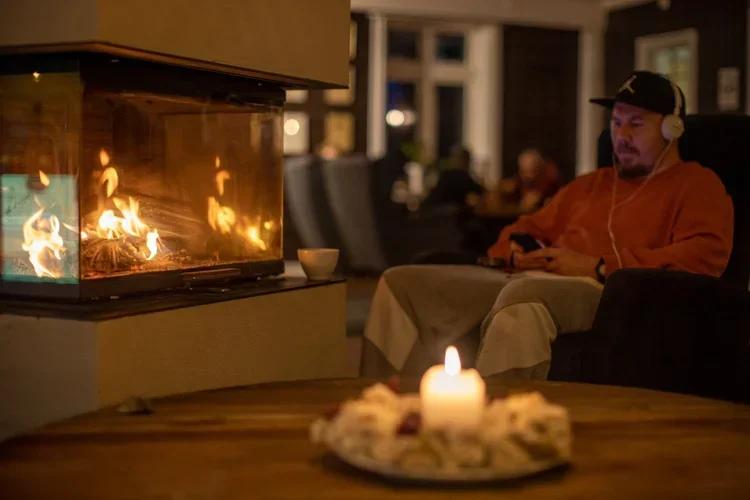 By the fireplace